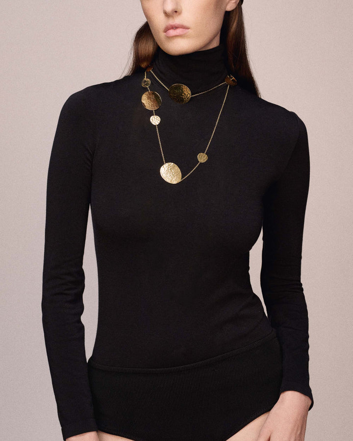 18K Gold Long Crinkle Station Necklace On Model, Black Turtleneck - Front View | IPPOLITA